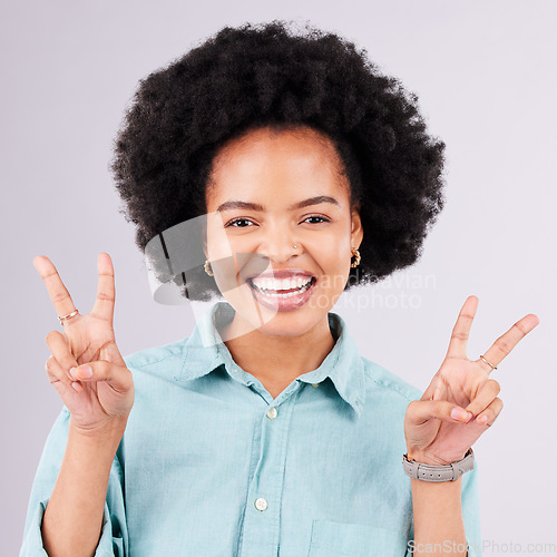 Image of Happy, peace sign and portrait of black woman in studio for positive, agreement and support. Confidence, smile and emoji with female isolated on gray background for friendly, cheerful and carefree
