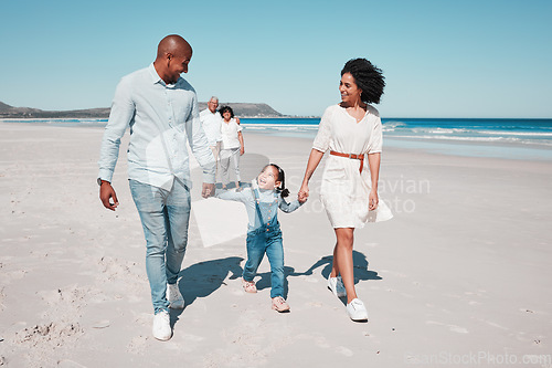 Image of Love, beach and family holding hands while walking together on a summer vacation, adventure or weekend trip. Happy, activity and parents with their child by the ocean on a tropical holiday in Mexico.