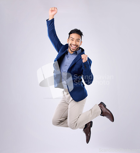 Image of Success, excited and portrait of an Asian man jumping isolated on a white background in a studio. Happy, winning and Japanese businessman in the air for achievement, celebration and enthusiastic