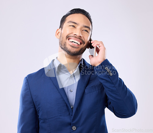 Image of Excited, business and Asian man with success, phone call and connection against a grey studio background. Japanese male employee, ceo and entrepreneur with smartphone, talking and networking signal