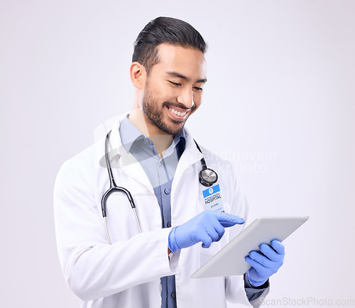 Image of Mockup, man and doctor with tablet, healthcare and success against a grey studio background. Male employee, medical professional and consultant with device, research and website for online reading