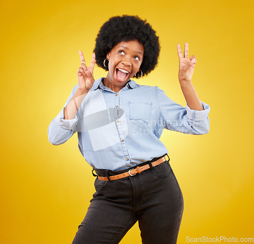 Image of Funny, happy and black woman with peace sign, smile and girl against a studio background. African American female, lady and gesture for chill, goofy and silly with joy, cheerful and positive mindset