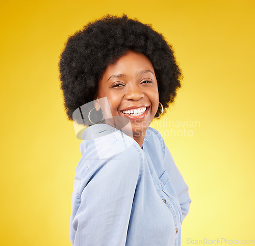 Image of Black woman, happy face and smile portrait in studio while excited on yellow background. African female model with afro hair, beauty and happiness on color space with motivation and positive mindset