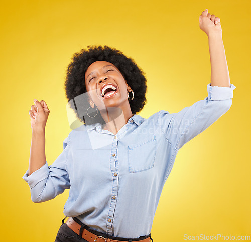 Image of Happy, cheering and excited black woman with freedom isolated on a yellow background in a studio. Smile, success and an African girl in celebration of an achievement, promotion or winning a prize