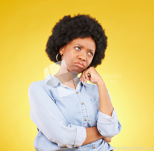 Image of Black woman, sad face and thinking in studio upset, sulking and disappointed on a yellow background. African female model think of memory, problem or mental health with afro hair and color space