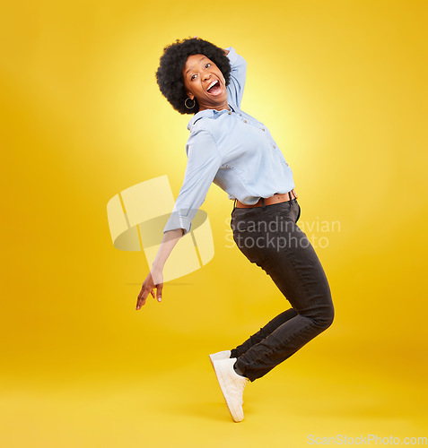 Image of Wow, excited and black woman in dance pose on yellow background with energy, happiness and smile in studio. Winner mockup, celebration and isolated happy girl dancing for freedom, winning and success