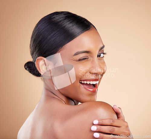 Image of Indian woman, beauty and skincare portrait with wink, smile and looking over shoulder with wellness. Young asian model, comic gen z girl and cosmetics for natural skin glow, aesthetic and happiness