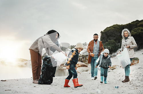 Image of Beach cleaning, trash and children, family or volunteering group in education, learning and community support. Grandparents, people and kids helping with plastic waste or garbage for pollution action