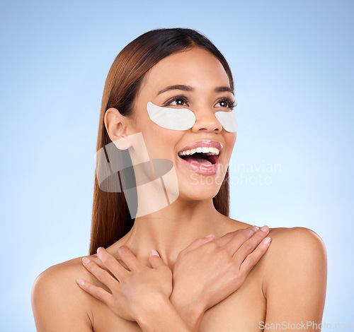 Image of Beauty, collagen and happy woman with eye mask for anti aging skincare on blue background mockup. Cosmetics, facial repair and face of hispanic model with detox treatment product in studio promotion.