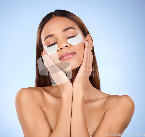 Image of Beauty, collagen and woman with eye mask for anti aging skincare glow on blue background mockup. Cosmetics, facial repair and face of hispanic model with wrinkle treatment product in studio promotion