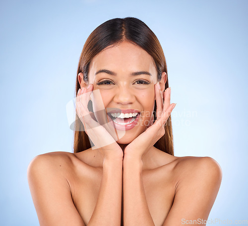 Image of Skincare, beauty and cosmetics, portrait of happy woman with smile for anti aging or skin glow promo on blue background. Makeup, facial massage and face of model with dermatology promotion in studio.