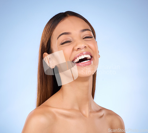 Image of Skincare, beauty and face of laughing happy woman in studio with smile for skin glow promo on blue background. Makeup, facial and cosmetics, African model for dermatology or spa promotion and mockup.