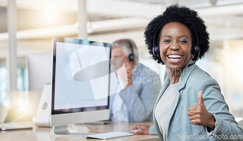 Image of Laughing, portrait and black woman in a call center with a thumbs up for online support and thank you. Smile, success and African customer service worker with an emoji hand gesture for achievement