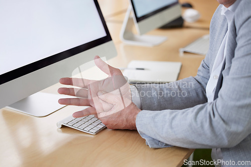 Image of Hand, carpal tunnel and joint pain with a business man in his office, sitting at a desk suffering from arthritis. Stress, medical or anatomy and a male employee struggling with osteoporosis or injury