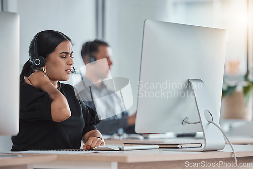 Image of Crm, neck pain and business woman in a call center office with shoulder injury. Telemarketing, customer support and employee feeling stress, tired and burnout from consultant job with fatigue