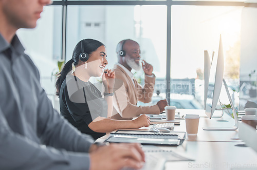 Image of Call center, laugh and consulting with woman in office for customer service, communication and help desk. Happy, contact us and technical support with employee at computer for crm, sales or advice