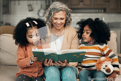 Image of Family kids, book and grandma reading fantasy storybook, story or bonding on home living room sofa. Grandmother love, novel and elderly woman with child development for biracial kindergarten children