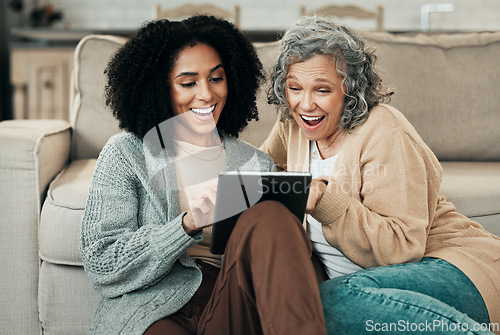 Image of Tablet, daughter or happy senior mother laughing at funny comedy meme, online joke or enjoy quality time together at home. Living room floor, internet and biracial family, people or mom and girl bond