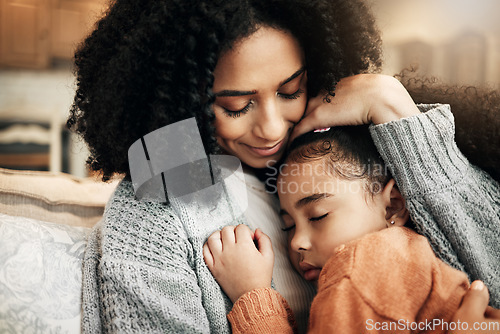 Image of Family, love or child hug mother for Mothers Day, home bonding or embrace on living room couch. Care, custody and biracial mom, mama or woman with female youth kid, girl or daughter cuddle on sofa