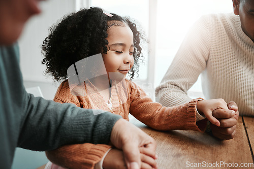 Image of Worship, girl and family holding hands, praying and spiritual practice in home, peace and quality time. Female child, believers and group with support, holy and bonding with joy, guidance and praise