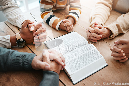 Image of Bible, reading book or hands of big family praying for support or hope in Christian home for worship together. Mother, father or grandparents studying, prayer or asking God in religion with children