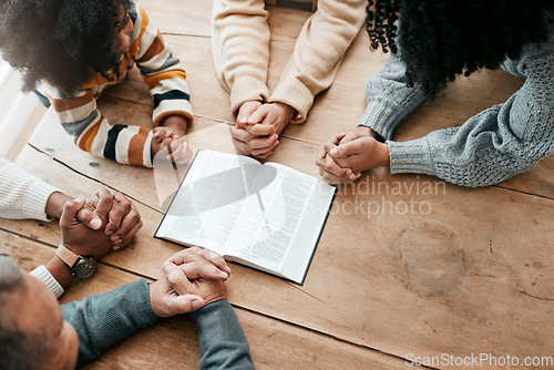 Image of Bible, reading book or hands of family in prayer, support or hope in Christianity home for worship together. Mother, father or grandparents studying, praying or learning God in religion with children