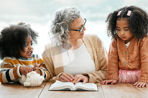 Image of Bible, reading book or grandma with children for worship, support or hope in Christianity for education. Kids siblings, grandmother or old woman studying, praying or learning of God in religion