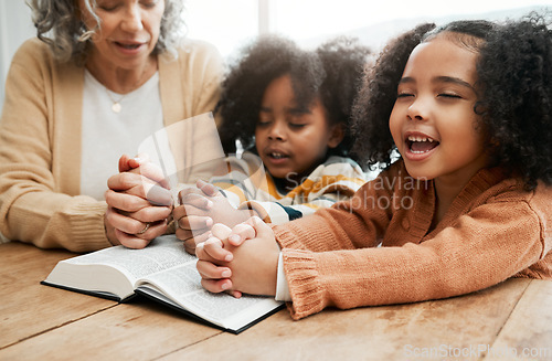 Image of Bible, worship or grandmother praying with kids or siblings for prayer, support or hope in Christianity. Children education, family or old woman studying, reading book or learning God in religion