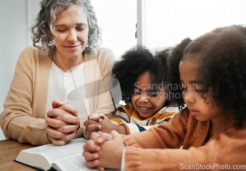 Image of Bible, prayer or grandmother praying with kids or siblings for worship, support or hope in Christianity. Children education, family or old woman studying, reading book or learning God in religion