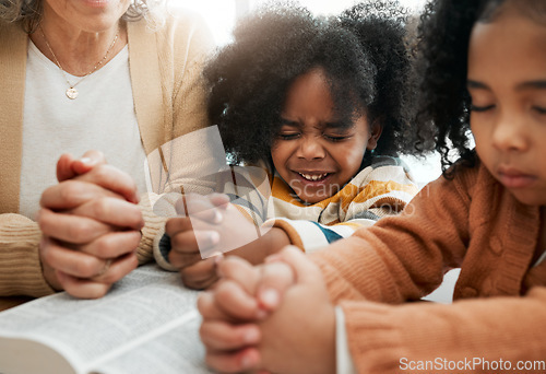 Image of Bible, prayer or hands of grandmother with kids or siblings for worship, support or hope in Christianity. Children education, praying or old woman studying, reading book or learning God in religion