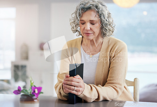 Image of Praying, senior woman and holy book for religion, faith and god help, support and spiritual healing at home. Prayer, gratitude and christian or elderly person with bible for hope, trust and worship