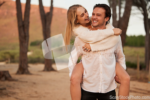 Image of Laugh, love and sunset with couple and piggyback in nature for romance, affectionate and bonding. Happiness, relax and smile with man carrying woman on date for vacation, cute and sweet relationship