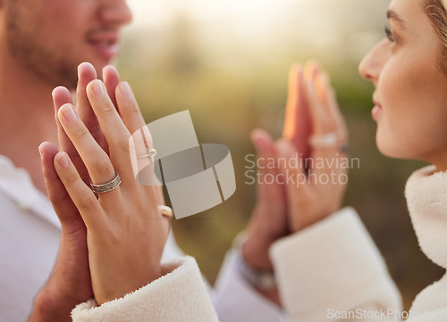 Image of Love, romance and couple touch hands at sunset for bonding, quality time and romantic weekend. Dating, honeymoon and man and woman with palms together for trust, support and loving for engagement