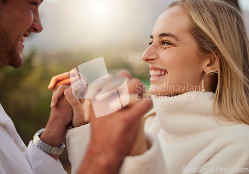 Image of Love, couple and holding hands outdoor with a smile, care and romance on date in nature. Young man and woman happy together on valentines day with trust, peace and support in forest for anniversary