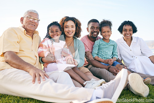 Image of Family, portrait and generations outdoor, happy people relax on lawn with grandparents, parents and kids. Happiness, smile and sitting together on grass, diversity and love with relationship and bond
