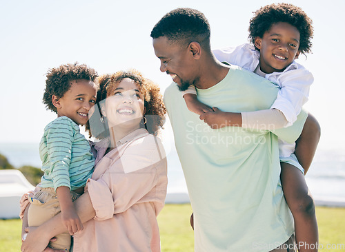 Image of Smile, love and happy black family at beach for summer travel, vacation and piggyback in a garden. Cheerful, relaxed and trip with children and parents embrace and bond while traveling in Mexico