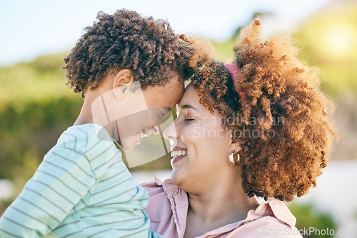 Image of Family, happy and woman hug kid, content together outdoor and face profile with forehead touch. Mother, young child and people with eyes closed, love and care with bond, relationship and smile