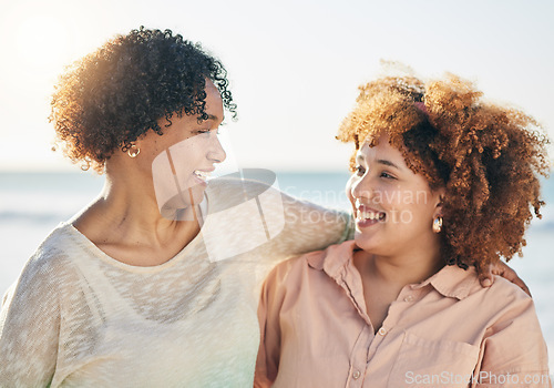 Image of Family, mother and adult daughter hug with smile and happiness outdoor, travel and adventure on vacation. People at beach, happy women and love, care and support, relationship and freedom in the sun