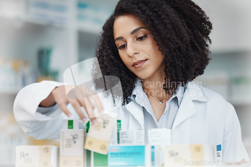 Image of Pharmacy, medicine and pills with woman reading side effects in store for healthcare, drugs dispensary and treatment prescription. Medical, shelf and pharmacist check label information on product