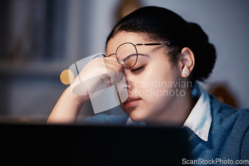 Image of Night, entrepreneur and woman with headache, burnout and overworked in workplace, deadline and mental health. Female employee, consultant and manager with stress, migraine and frustrated with fatigue