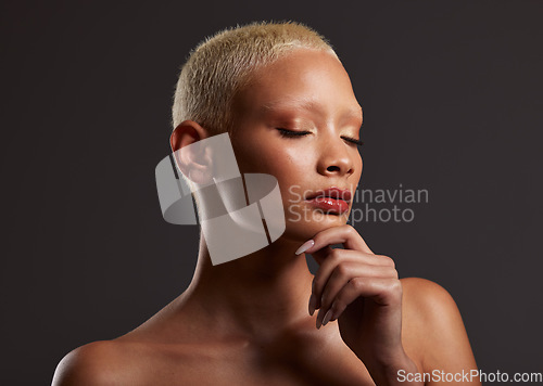 Image of Skincare, makeup and face of black woman, eyes closed and dark studio with platinum hair. Art aesthetic, cosmetics and beauty, African model isolated on grey background with glowing spa skin facial.