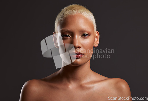 Image of Beauty, makeup and portrait of black woman in dark studio with platinum hair isolated on grey background. Art aesthetic, cosmetics and face of African model in skin glow and luxury spa facial promo.