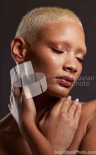 Image of Face of black woman, dark studio and makeup, platinum hair and beauty isolated on grey background. Skincare, art aesthetic and cosmetics, and beautiful African model in skin glow and edgy spa facial.