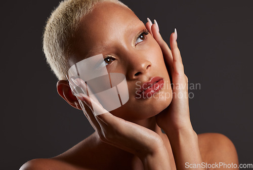 Image of Beauty, makeup and cosmetics, black woman looking up in dark studio with platinum hair isolated on grey background. Art aesthetic, cosmetics and beautiful African model in skin glow and luxury facial