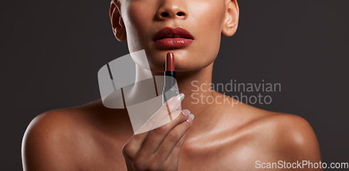 Image of Beauty, makeup and lips of woman with lipstick in studio for cosmetics, skincare products and fashion. Salon aesthetic, cosmetology and girl model with red gloss for beauty, mouth and luxury style
