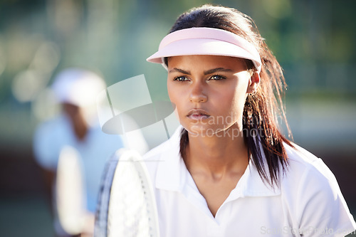 Image of Serious, fitness and tennis with woman on court for focus, training and sports workout. Competition match, exercise and games with female athlete playing for strong, summer and concentration