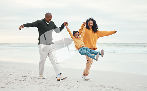Image of Play, mother and father with child on beach enjoy holiday, travel vacation and weekend together. Happy family, parents and dad, mom and kid holding hands for bonding, quality time and swinging by sea