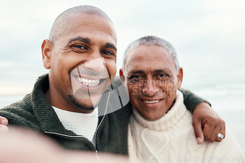 Image of Smile, portrait and selfie by father with adult son hug at beach for travel, bond and having fun. Face, photo and man with mature parent on ocean trip in Miami, happy and pose for profile picture