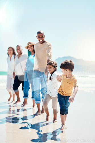 Image of Walking, portrait and a big family holding hands at the beach for a walk, bonding and playing. Love, carefree and children at the sea with grandparents and parents on a holiday in Spain together