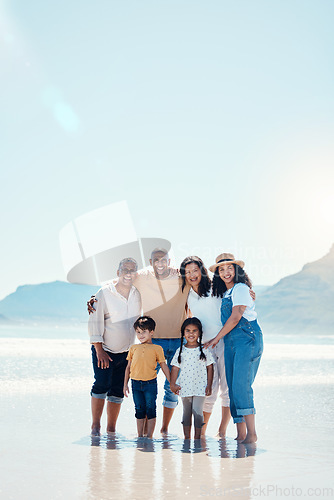 Image of Family, beach portrait and smile on vacation, bonding and love in summer sunshine by mock up space. Group, men and women with children with happiness, freedom and adventure by sea waves on holiday